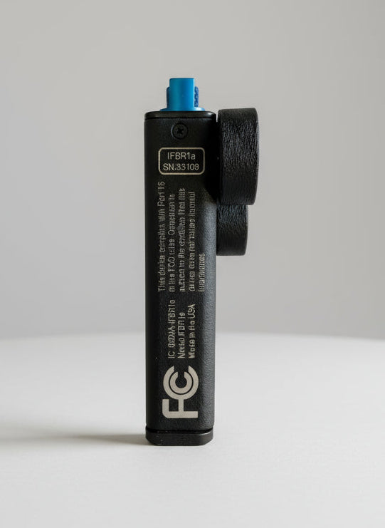 Black electronic device with branding and specifications on a black background