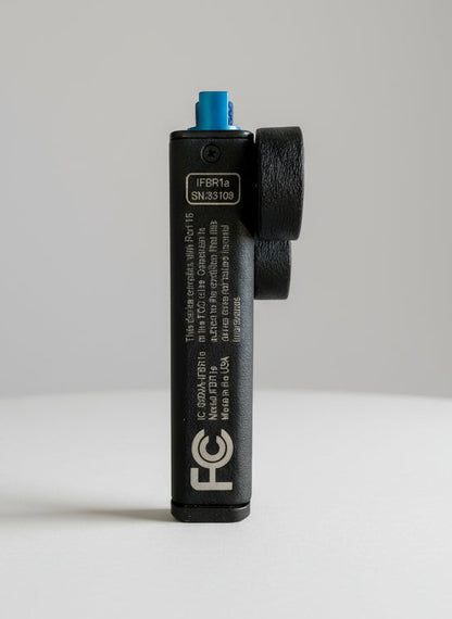 Black electronic device with branding and specifications on a black background